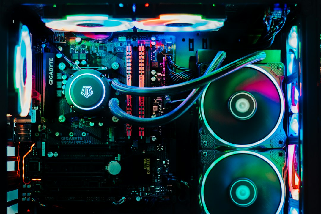 A close up of a computer motherboard in a dark room
