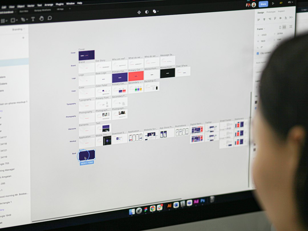 A woman is looking at a computer screen