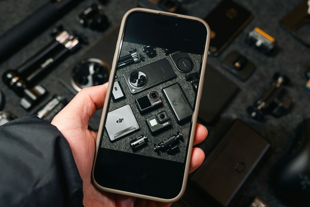 Phone displaying a photo of various tech gadgets