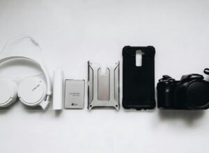 White Sony headphones and black smartphone case