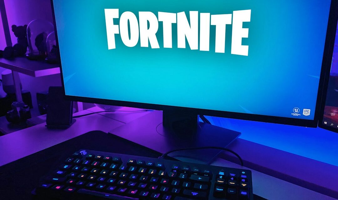 Black flat screen computer monitor with black computer keyboard