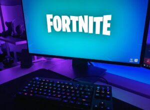 Black flat screen computer monitor with black computer keyboard