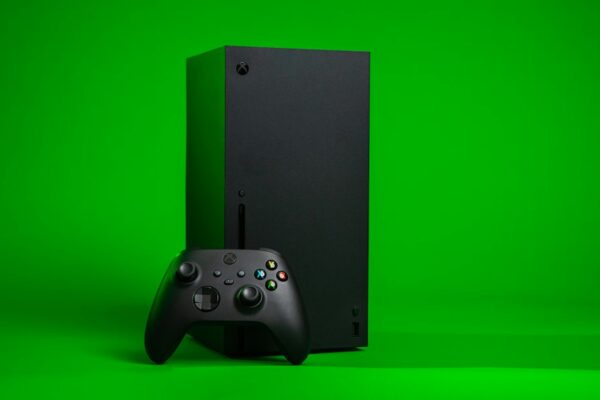 Black xbox one console with controller