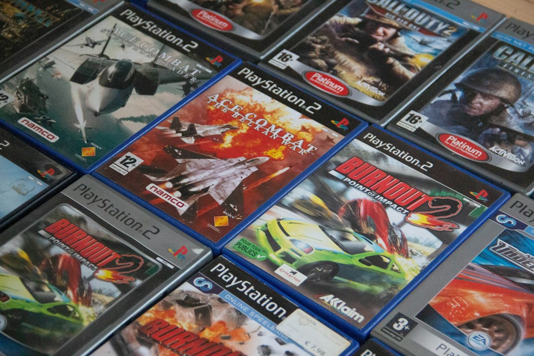 A pile of video games sitting on top of a table