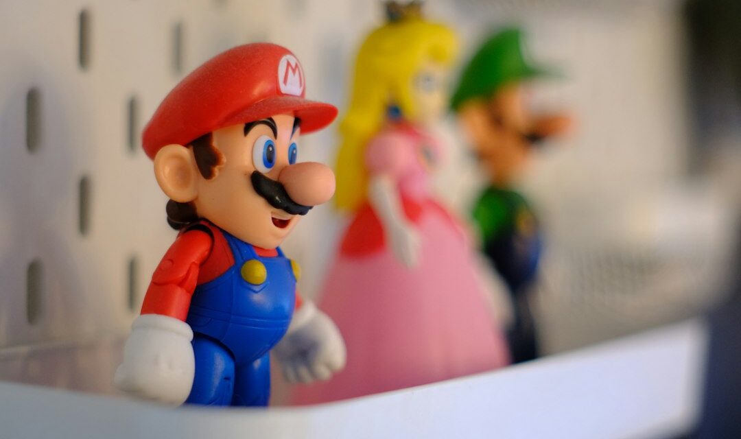 Mario, princess peach, and luigi figures on a white shelf