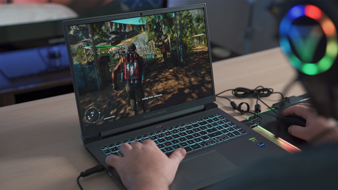 A person playing a video game on a laptop