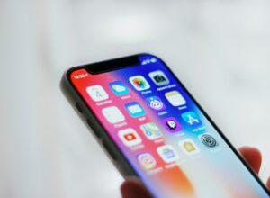 Person holding black iphone 4