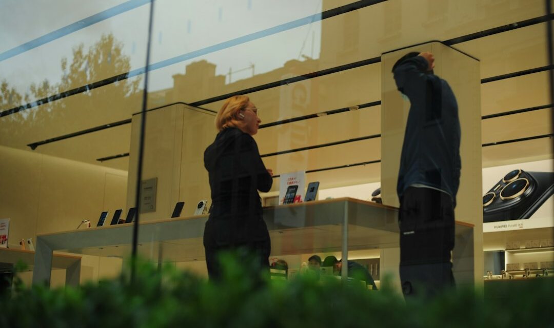 Two people talking inside a store