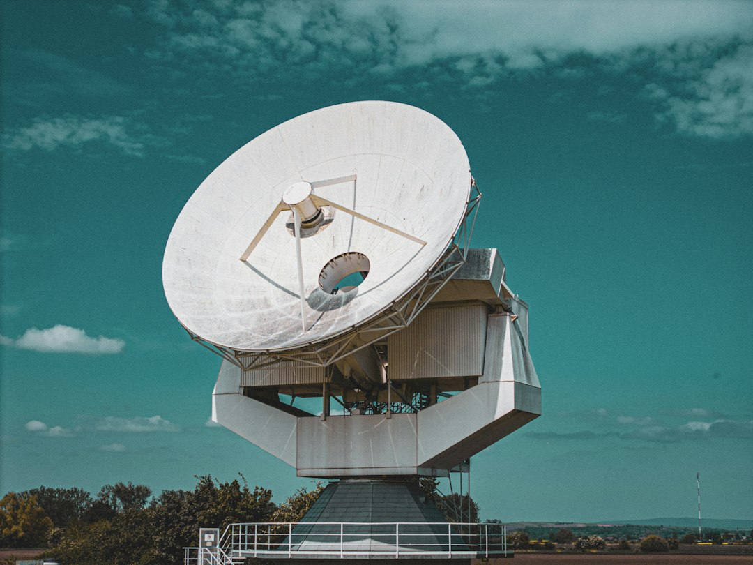 Large satellite dish against a blue sky