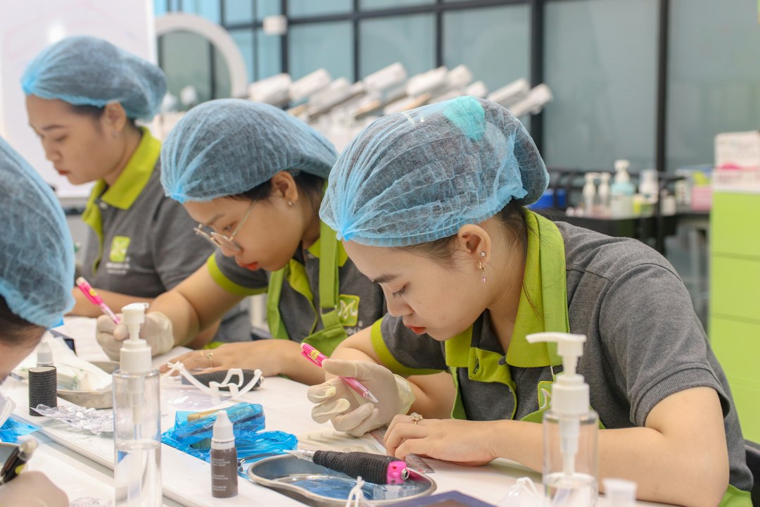 A group of women in scrubs working on a project