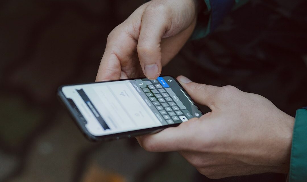 Selective focus photography of person using smartphone