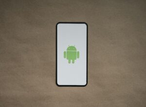 A cell phone with a green icon on it