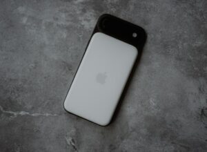 White smartphone with black camera lens attachment