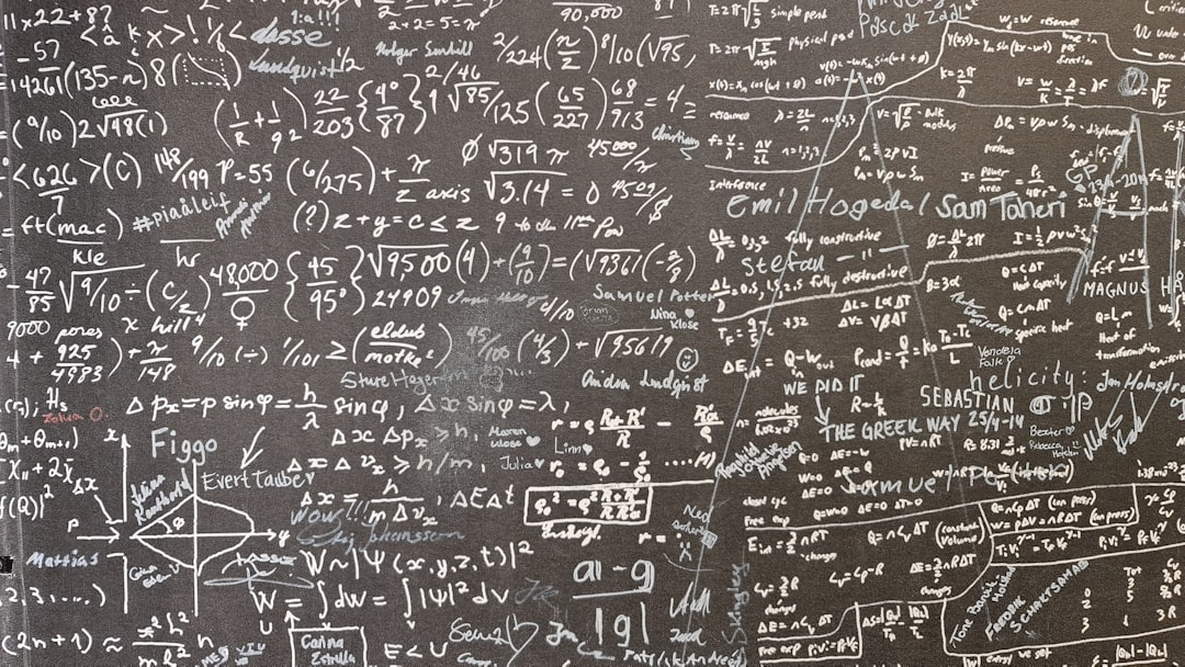A blackboard with a lot of writing on it
