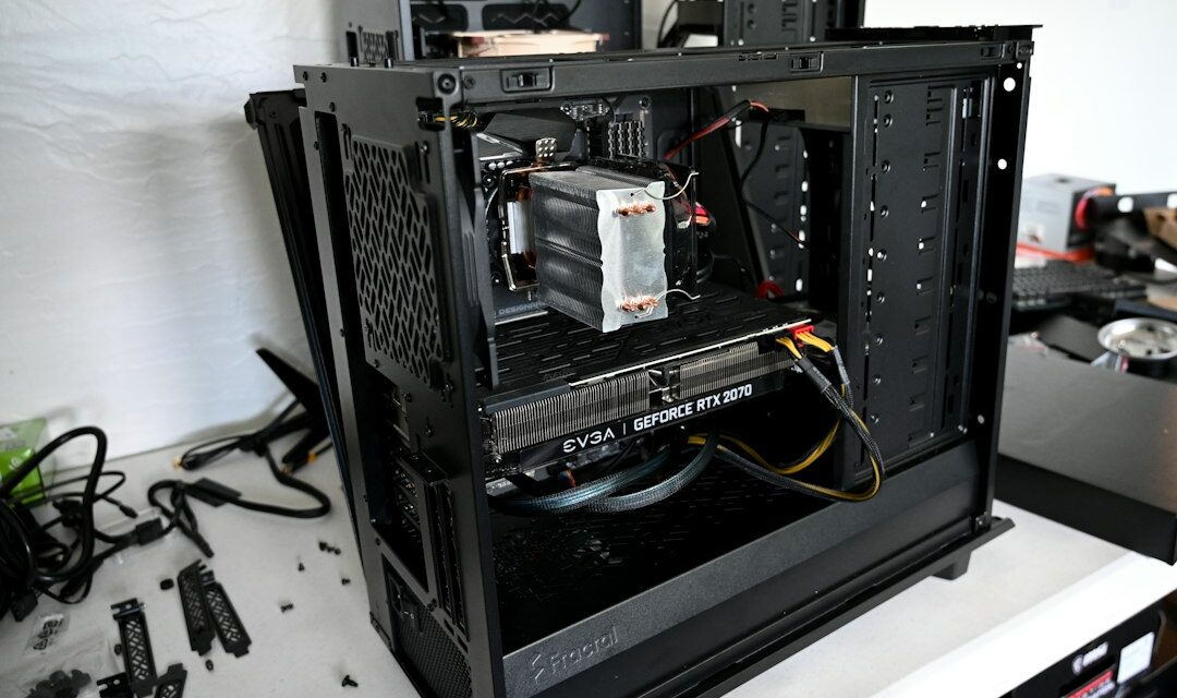 Black computer tower on white table