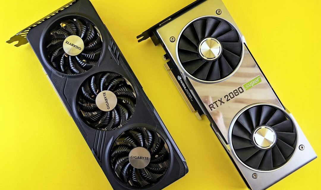 A close up of two computer fans on a yellow surface