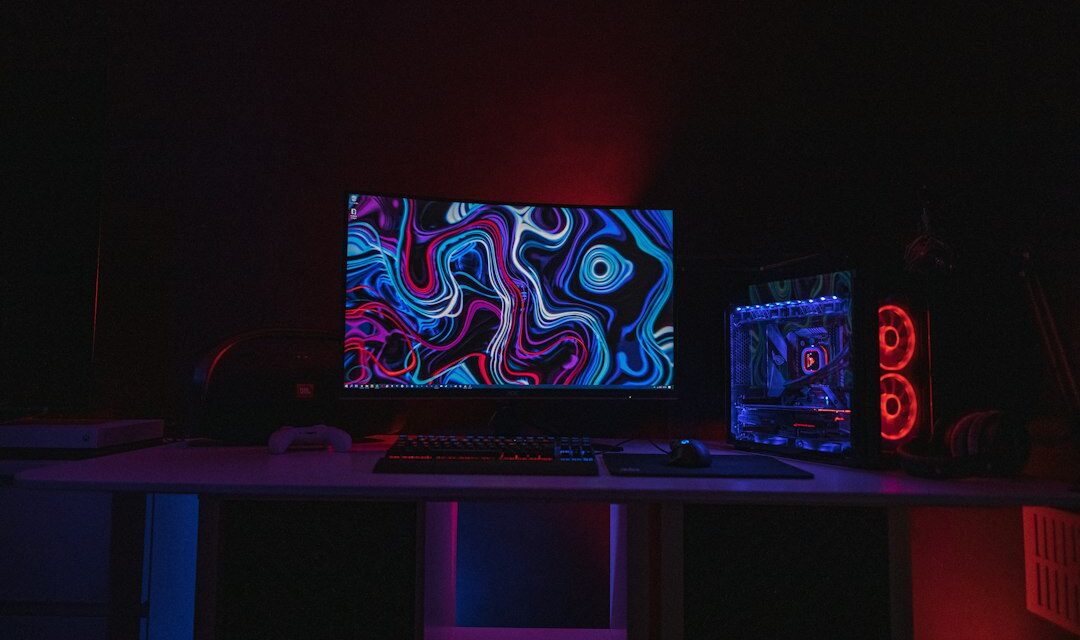 Black flat screen computer monitor turned on displaying desktop