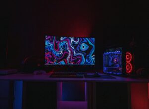 Black flat screen computer monitor turned on displaying desktop