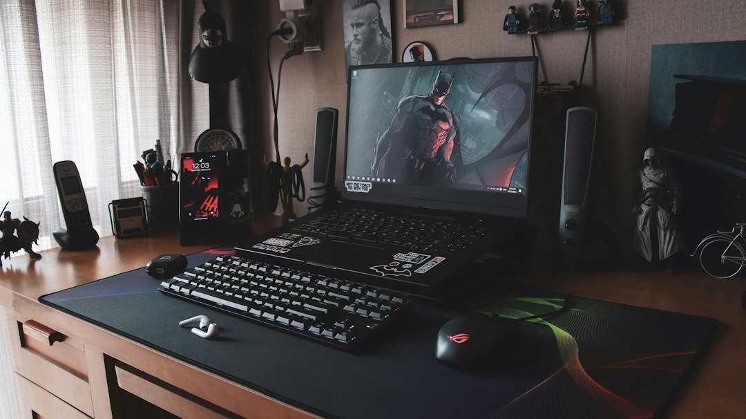 A laptop sits on top of a desk