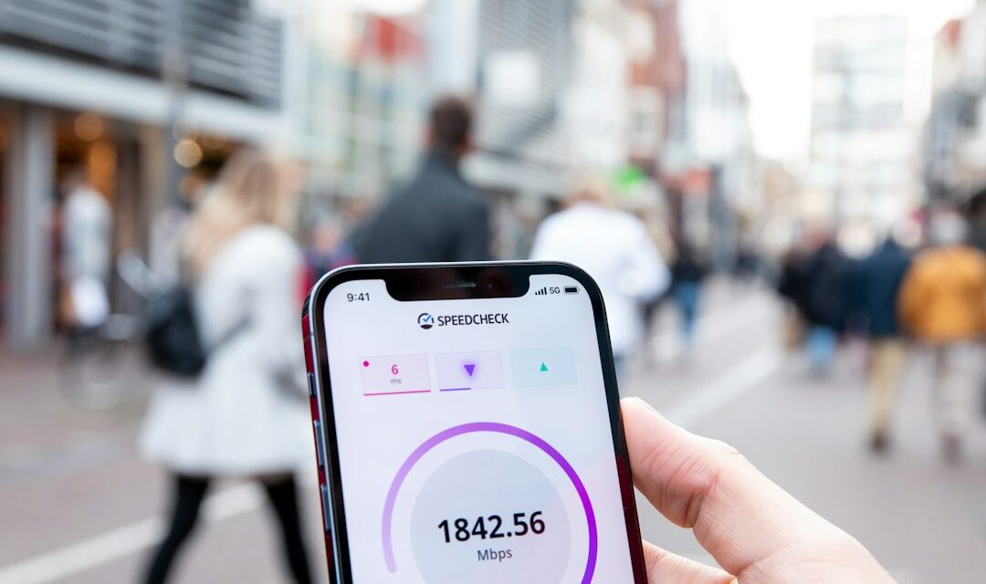 A person holding a cell phone in their hand