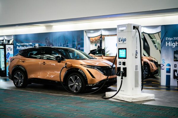 An electric car plugged into a charging station