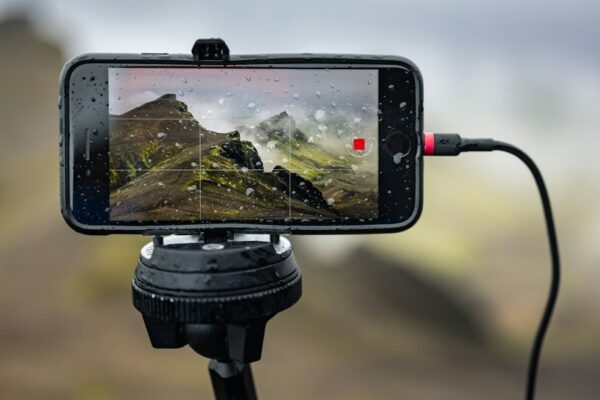 A cell phone is attached to a tripod