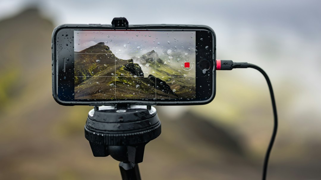 A cell phone is attached to a tripod