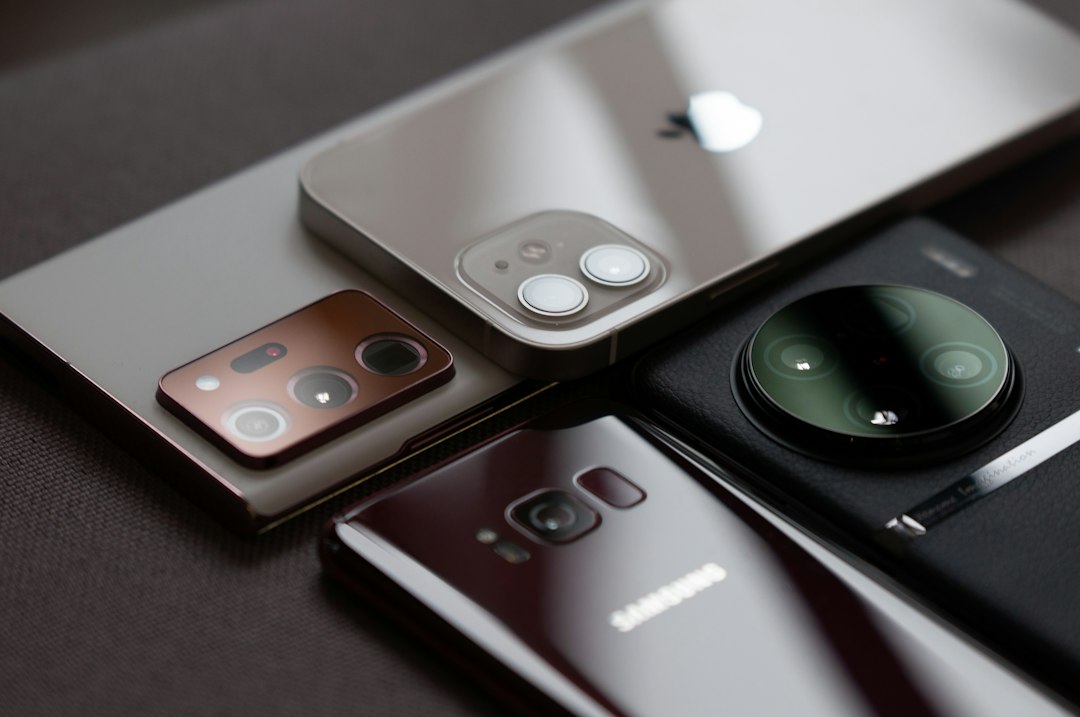 A group of cell phones sitting on top of a table
